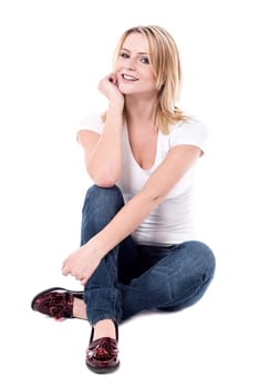 Thoughtful young woman with hand on chin over white