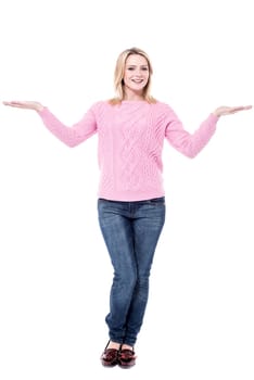 Beautiful woman making a scale with her arms wide open