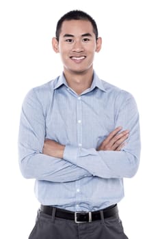 Young man posing with folded arms over white