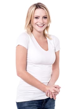 Beautiful young woman posing with clasped hands