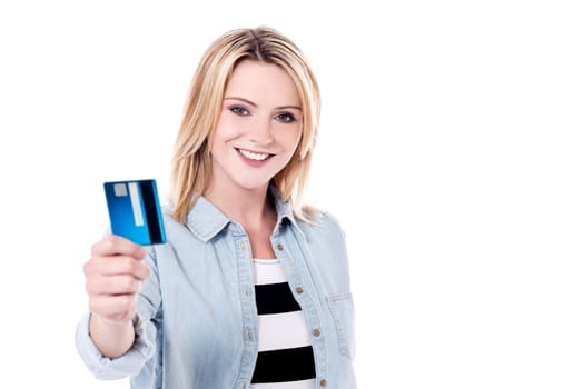 Trendy woman showing her cash card to camera