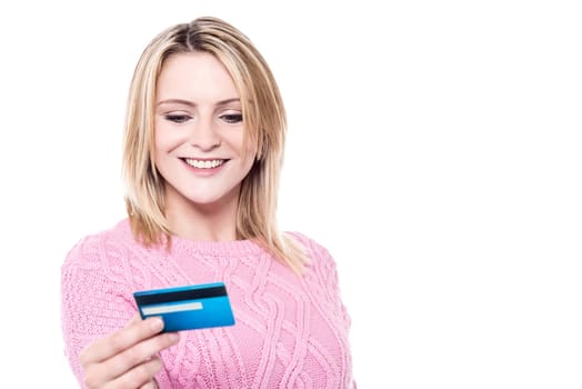 Young woman looking her cash card over white