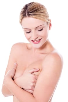 Unclad woman covering her breasts
