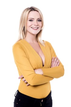 Stylish woman posing to camera with folded arms