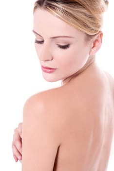 Topless young woman looking over her shoulder