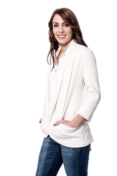 Trendy woman posing with hands in pockets