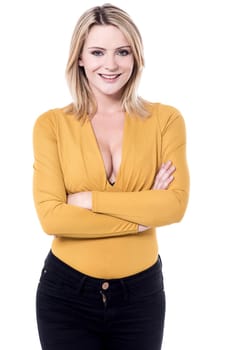 Young woman in party wear with folded arms