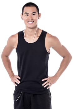 Handsome, young and fit man with earphones