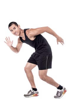 Fitness man ready to run over white background