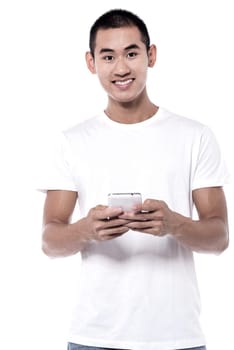 Picture of a young handsome man having smartphone