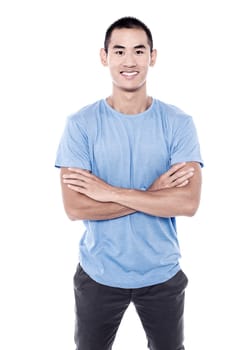 Attractive young man in casual clothing with crossed arms