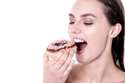 Woman about to eat a donut over white background