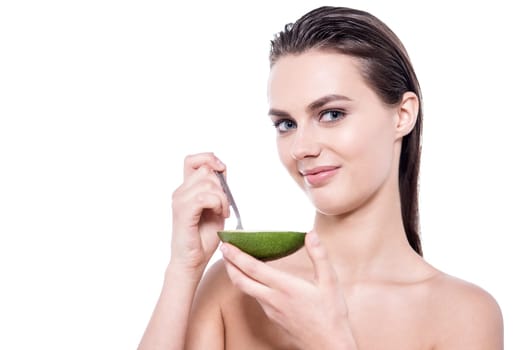 Attractive woman holding fruit over white background