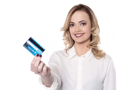 Beautiful woman showing credit card