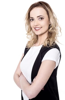 Smiling trendy lady posing arms crossed
