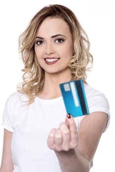 Pretty lady in white showing credit card
