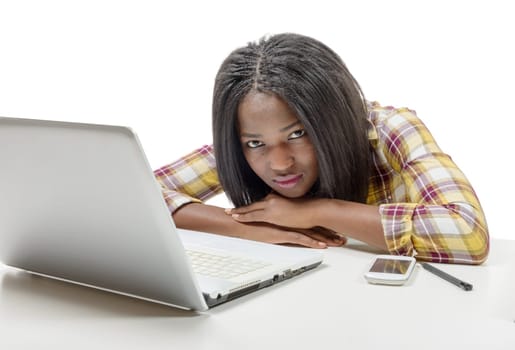 a beautiful young African American teenage girl with laptop