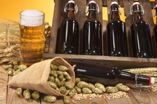 bierkasten and beer glass with wheat,barley,hops and malt\n