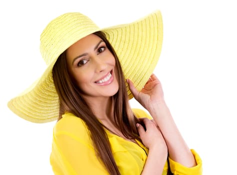 young woman wearing yellow shirt and hat on white background