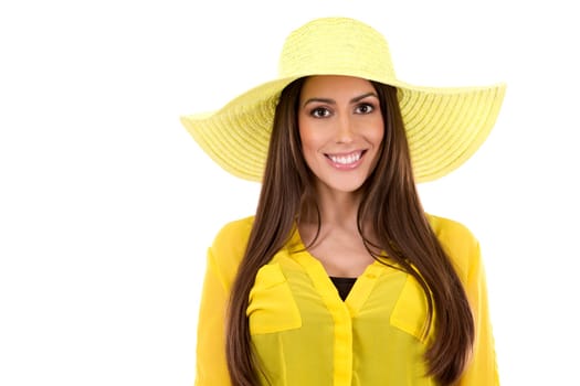 young woman wearing yellow shirt and hat on white background