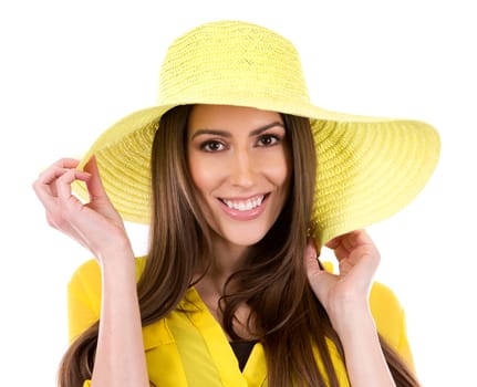 young woman wearing yellow shirt and hat on white background