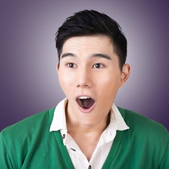 Funny facial expression, closeup Asian young man.