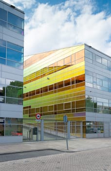 exterior of a modern glass office building in the netherlands
