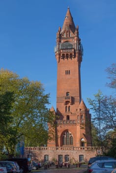 Grunewald tower in the autumn sun with parking in front of it