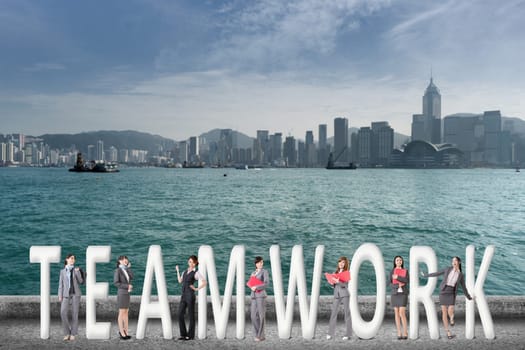Concept of teamwork with group of business people stand with 3d text.