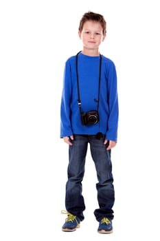 six years old boy taking photos with his camera on white background