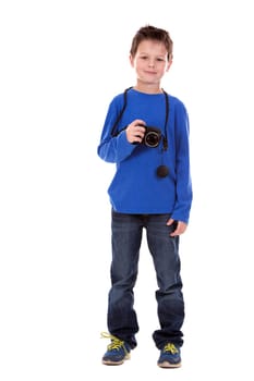 six years old boy taking photos with his camera on white background
