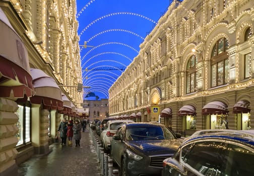 Moscow, Russia - January 05, 2016: Night Christmas illuminations on buildings in Vetoshny lane. GUM building on the right