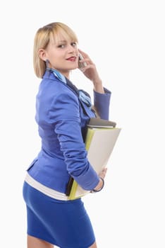an attractive blond woman in blue business suit, phone