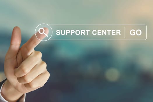 business hand clicking support center button on search toolbar with vintage style effect
