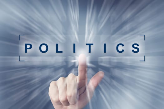 hand clicking on politics button with zoom effect background