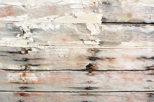 Wooden wall with paint residues