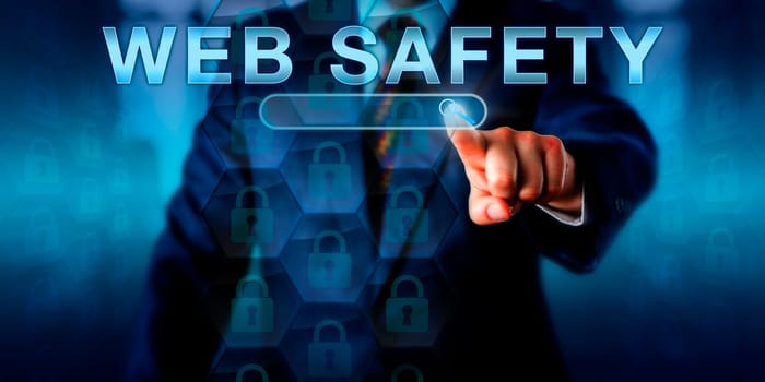 Corporate internet user pressing WEB SAFETY on a touch screen interface. Information technology and cybersecurity concept for self-protection from cyber security risks to privacy and computer crime.