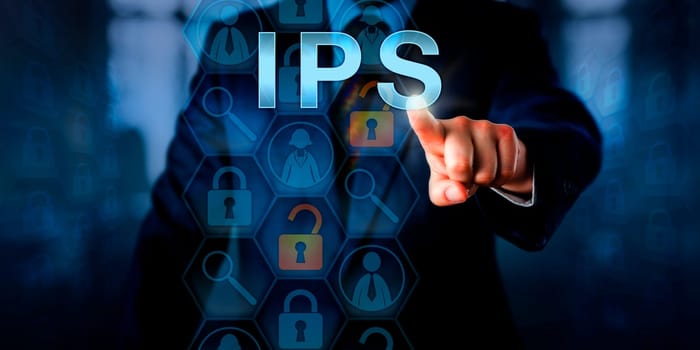 Corporate systems administrator is pushing IPS on a touch screen. Information technology and computer security concept for an intrusion prevention system that blocks malicious network connections.