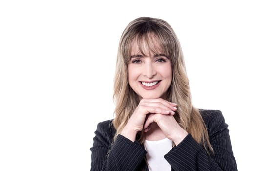 Smiling secretary posing to camera against white