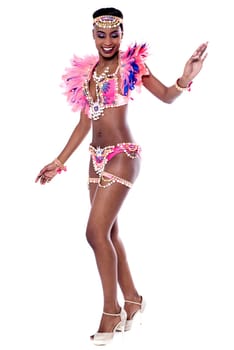 Pretty passionate woman performing dance over white