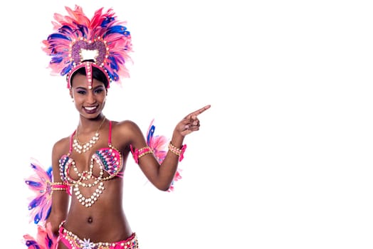 Female samba dancer pointing index finger at something