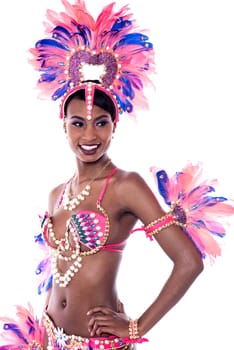 Attractive young samba dancer posing with hand on hip