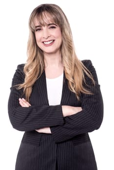 Middle aged business woman posing with arms crossed