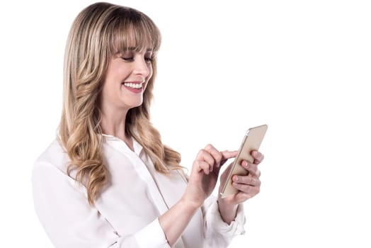 Attractive woman using her smart phone over white