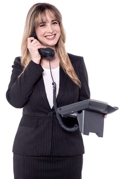 Smiling middle aged business woman on phone