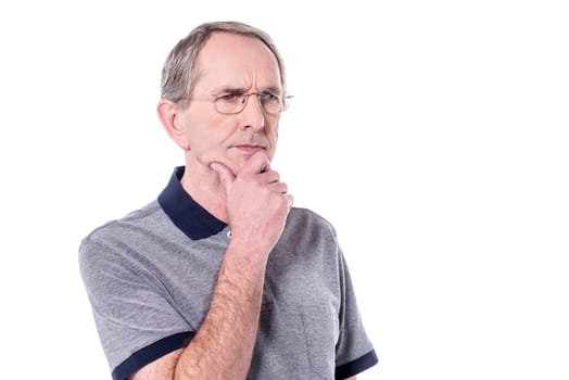 Senior man thinking about something over white.