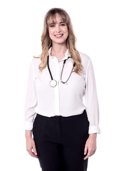Female doctor posing to the camera over white