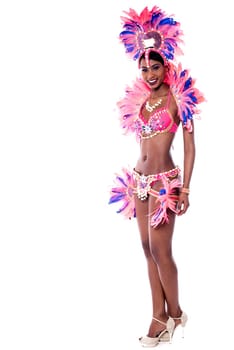 Young elegant dancer posing to camera over white