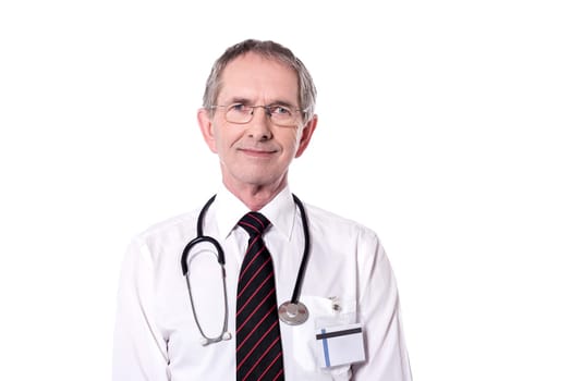Caucasian senior doctor posing isolated over white background