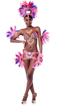 Young woman dancer in action with hand on hip